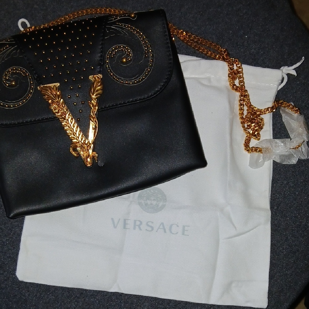 Versace Virtus clutch bag in black leather with gold-tone stud details